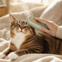 Petting a cat with the PawCare steam grooming brush