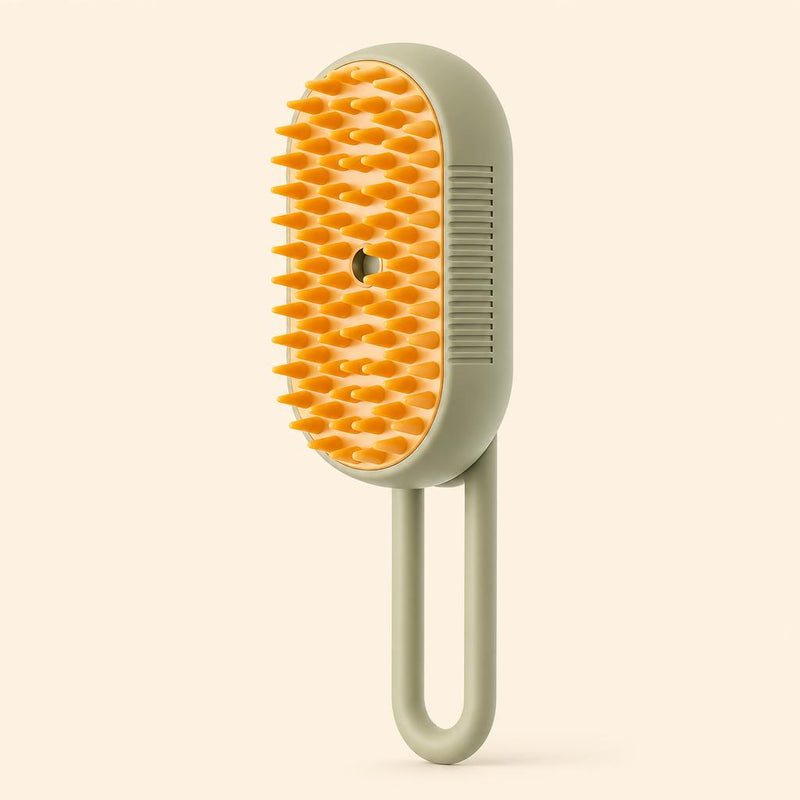 PawCare 3-in-1 steam grooming brush floating on a cream background